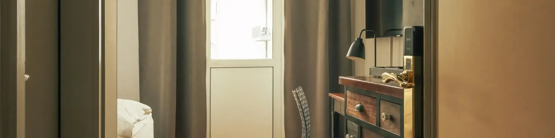 a room with a dresser and a chair