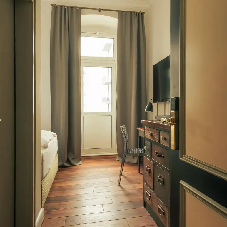 a room with a dresser and a chair