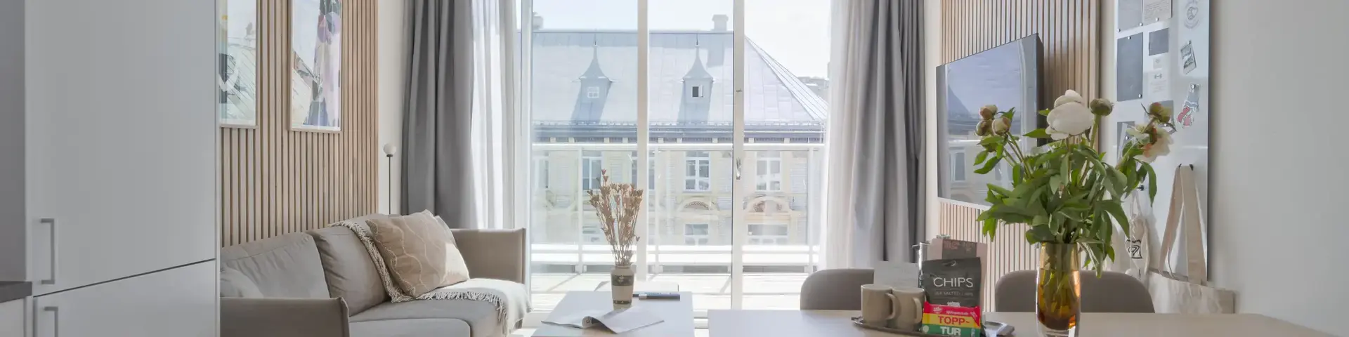 a living room with a table and chairs