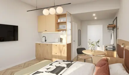 a bedroom with a kitchen and dining area
