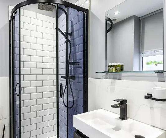 a bathroom with a shower and sink