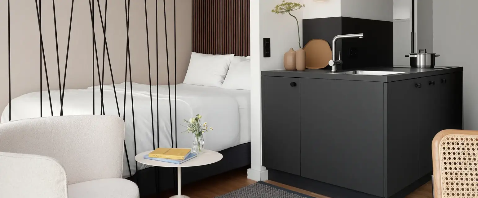 a room with a bed and a sink