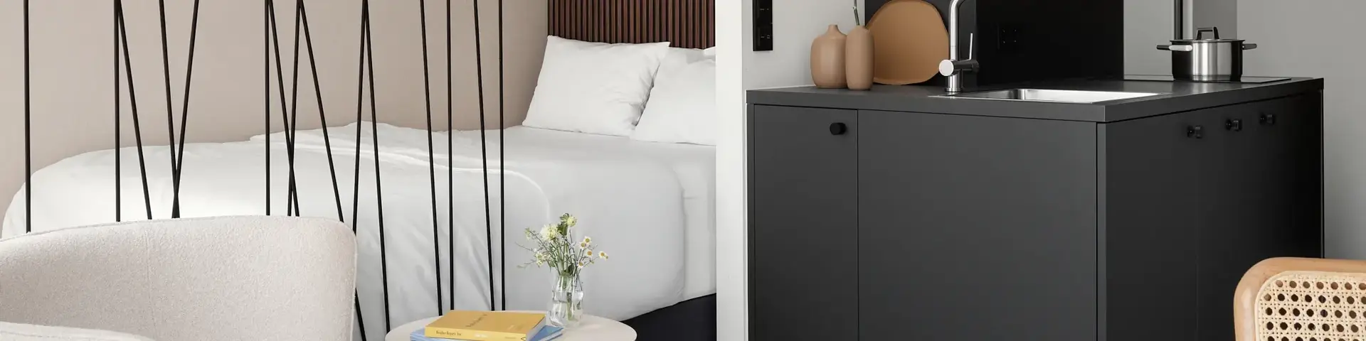 a room with a bed and a sink