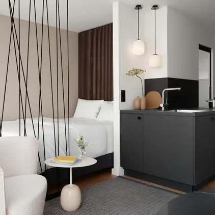 a room with a bed and a sink