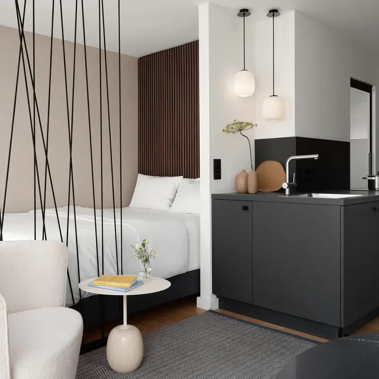 a room with a bed and a sink