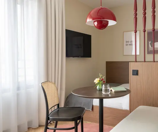 a room with a table and a tv
