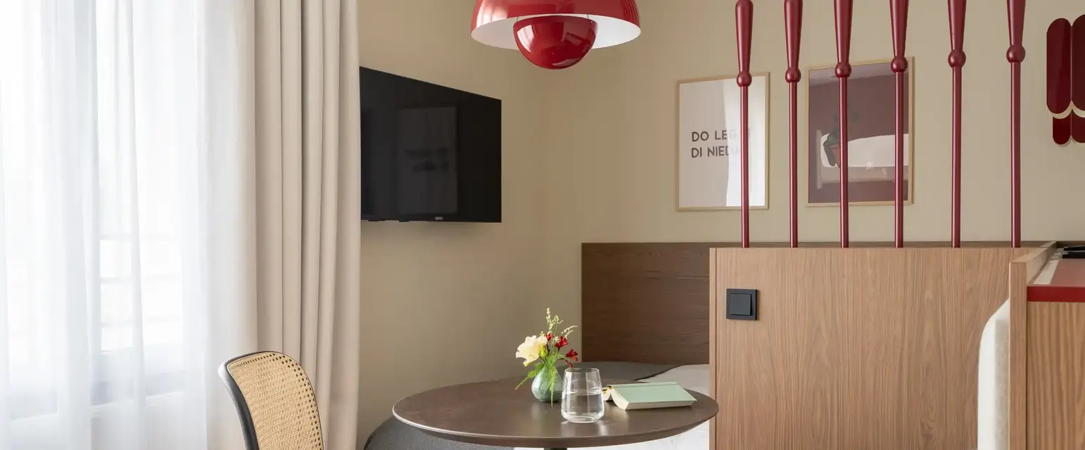 a room with a table and a tv