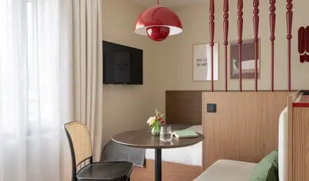 a room with a table and a tv