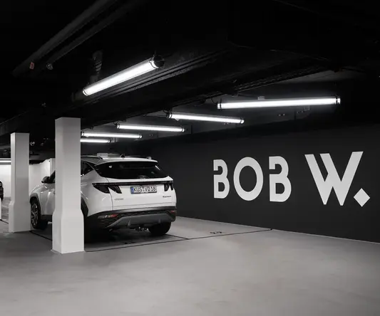 a white car parked in a parking garage