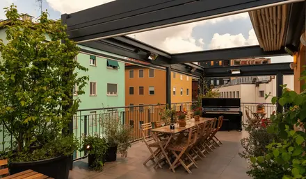 a patio with a table and chairs