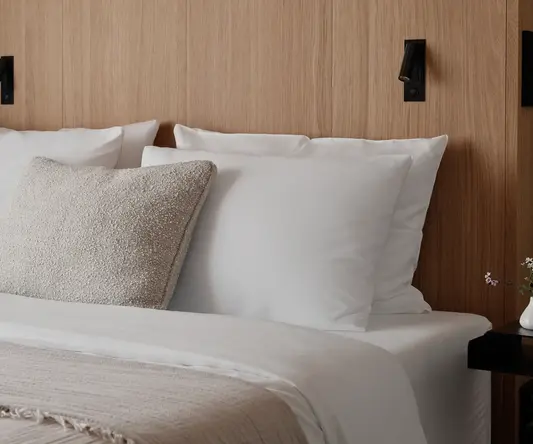 a bed with white pillows