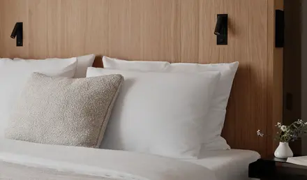 a bed with white pillows