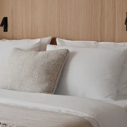 a bed with white pillows