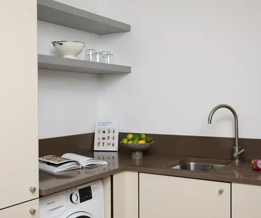 a kitchen with a sink and a book