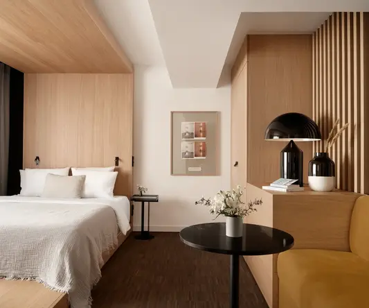 a bedroom with a bed and a table