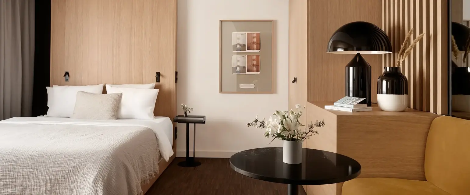 a bedroom with a bed and a table