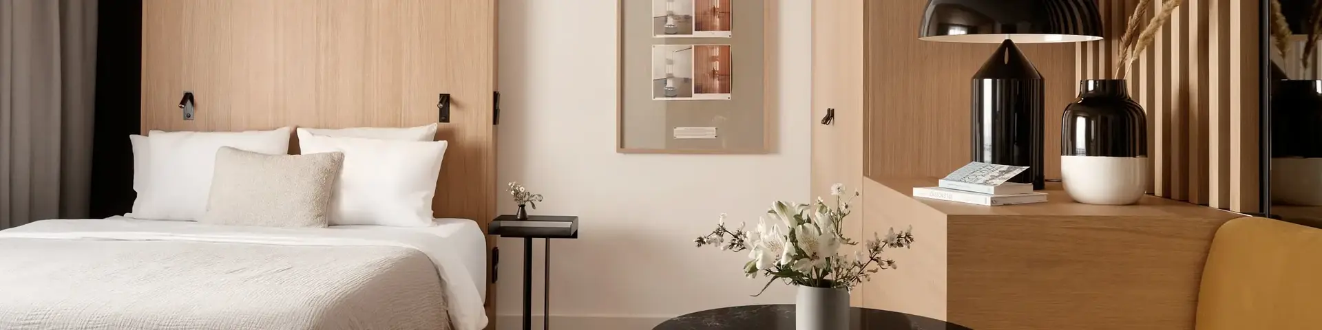 a bedroom with a bed and a table