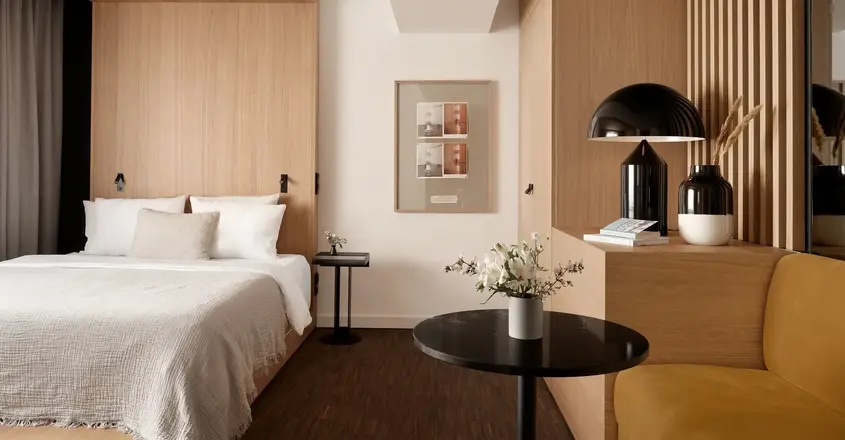 a bedroom with a bed and a table