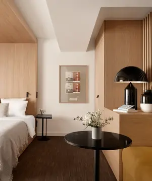 a bedroom with a bed and a table