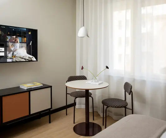 a room with a table and chairs