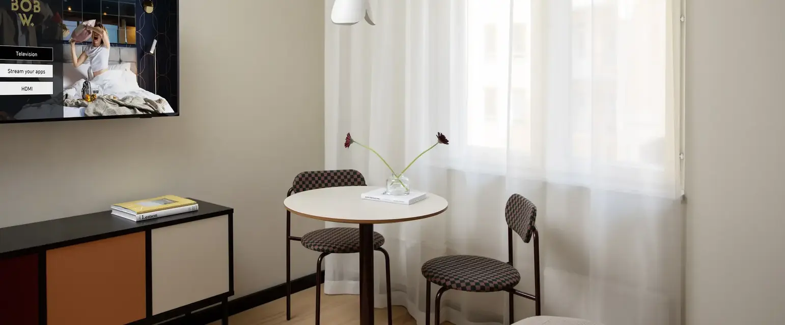 a room with a table and chairs