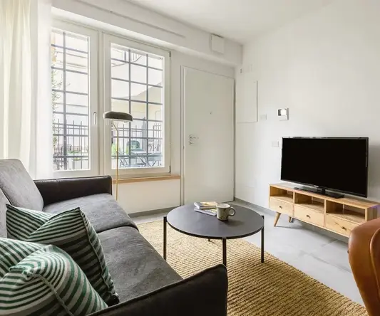 a living room with a couch and a tv