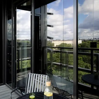 a chair and table on a balcony