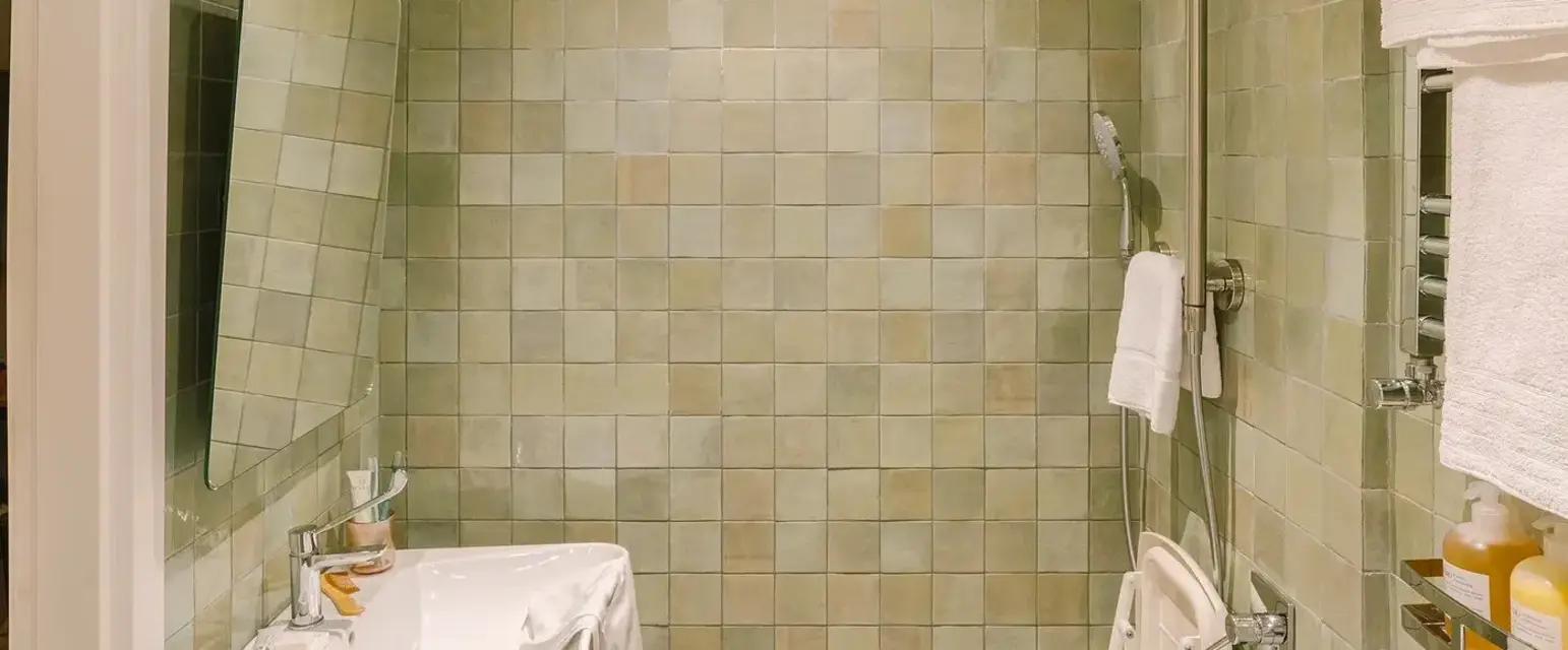 a bathroom with a shower and sink