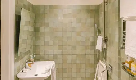 a bathroom with a shower and sink