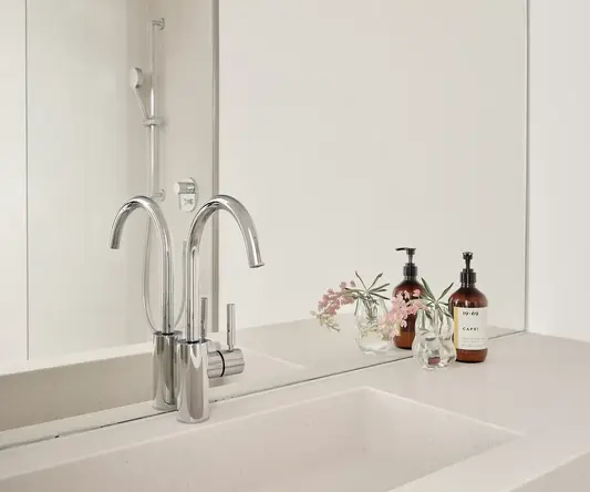 a bathroom with a shower and sink