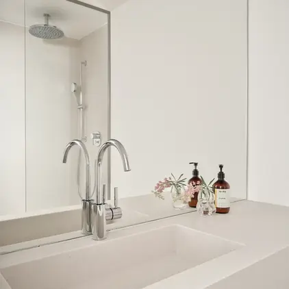 a bathroom with a shower and sink