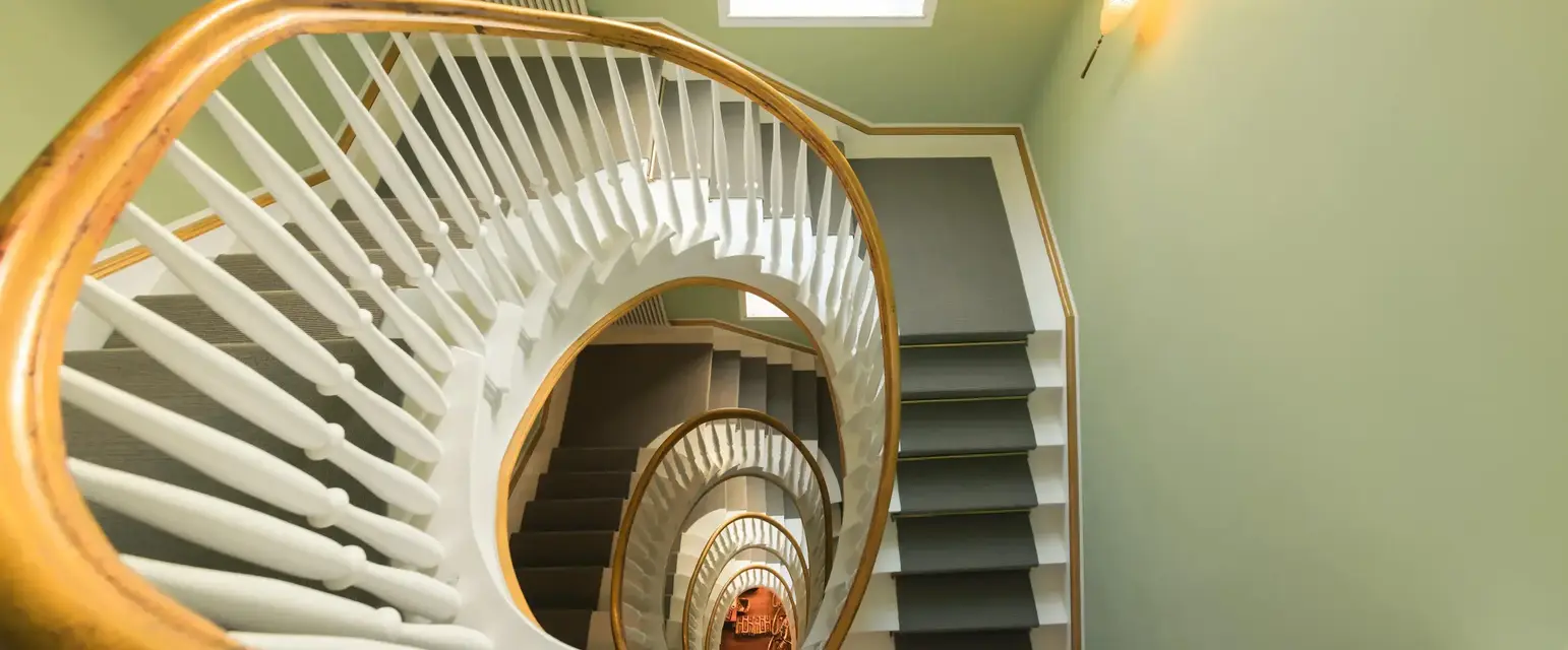 a spiral staircase with a window