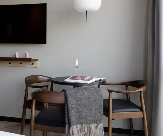 a table with chairs and a book