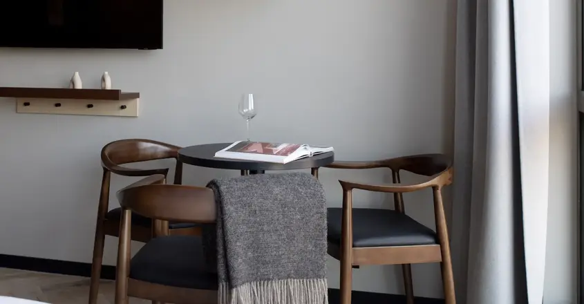 a table with chairs and a book