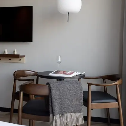 a table with chairs and a book