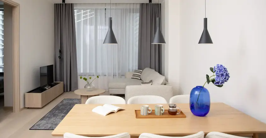 a room with a table and chairs