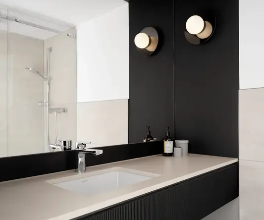 a bathroom with a sink and mirror