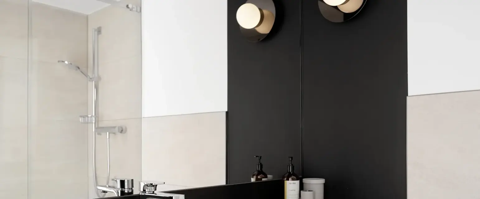 a bathroom with a sink and mirror