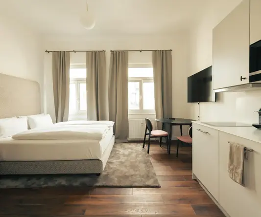 a bedroom with a bed and a table