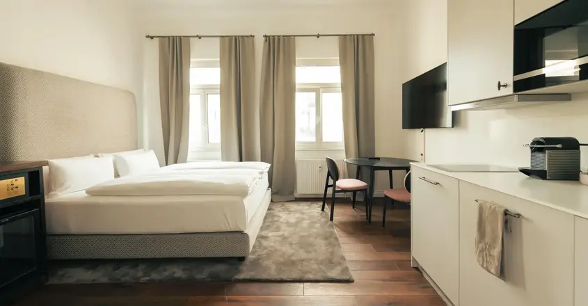 a bedroom with a bed and a table