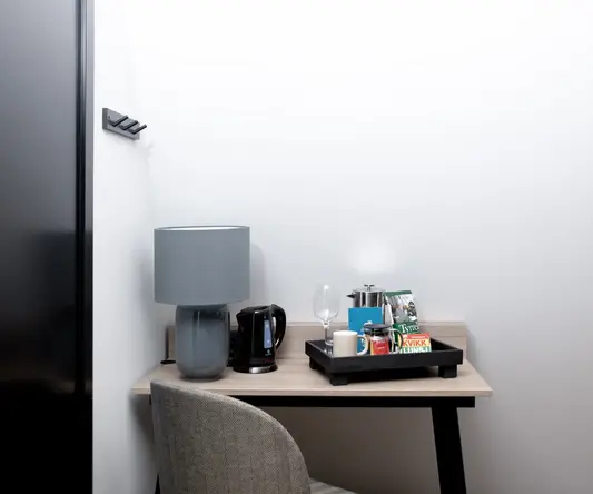 a table with a tray of coffee and other objects on it