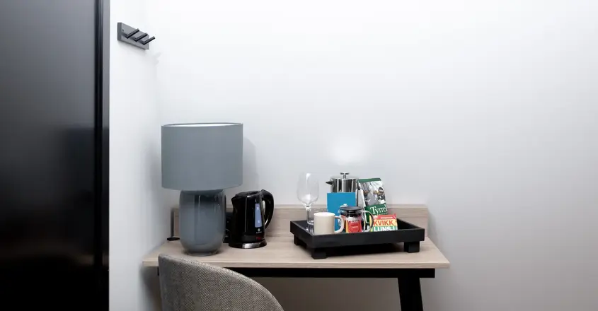 a table with a tray of coffee and other objects on it