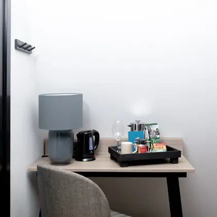 a table with a tray of coffee and other objects on it