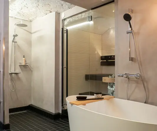 a bathroom with a tub and shower