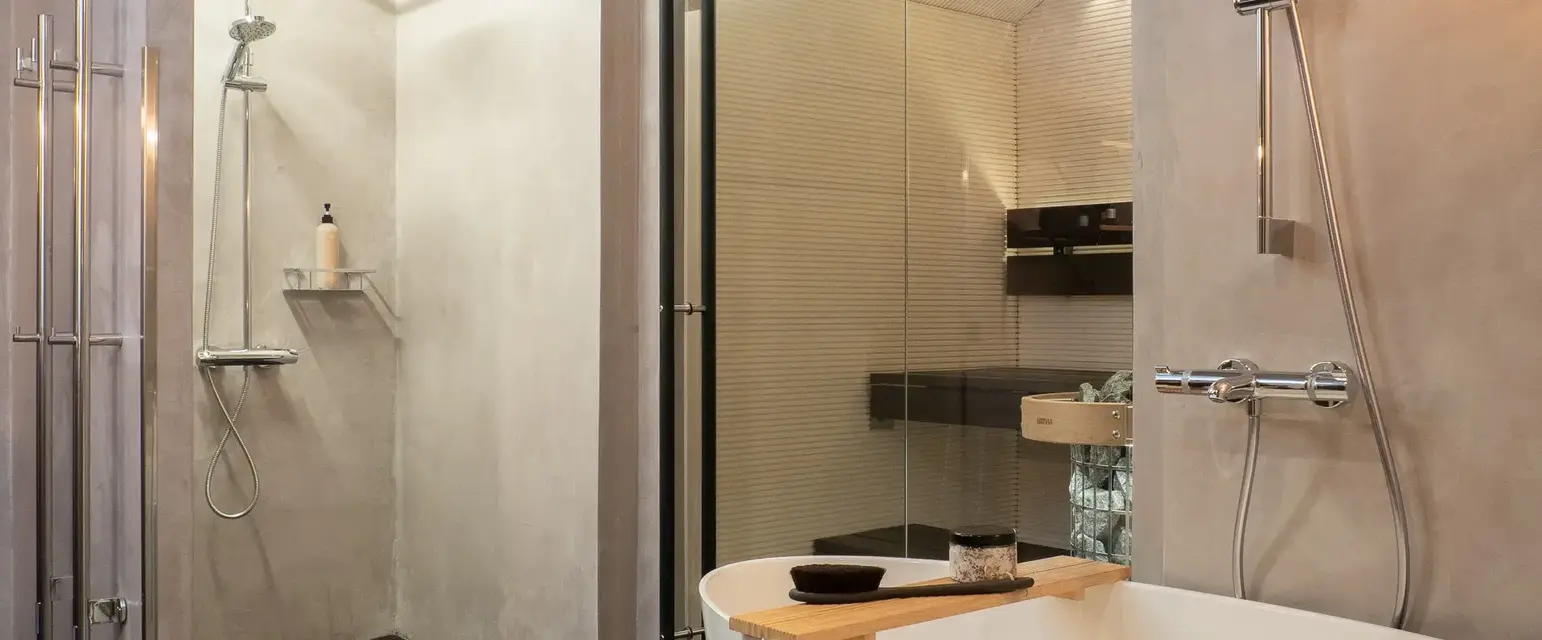 a bathroom with a tub and shower