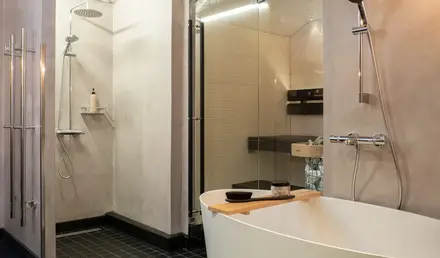 a bathroom with a tub and shower