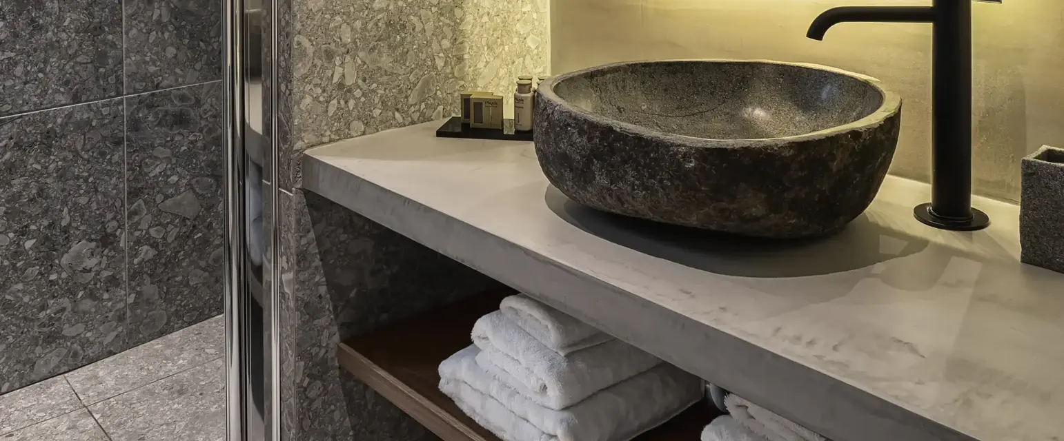 a bathroom with a sink and a shower