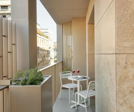 a table and chairs on a balcony
