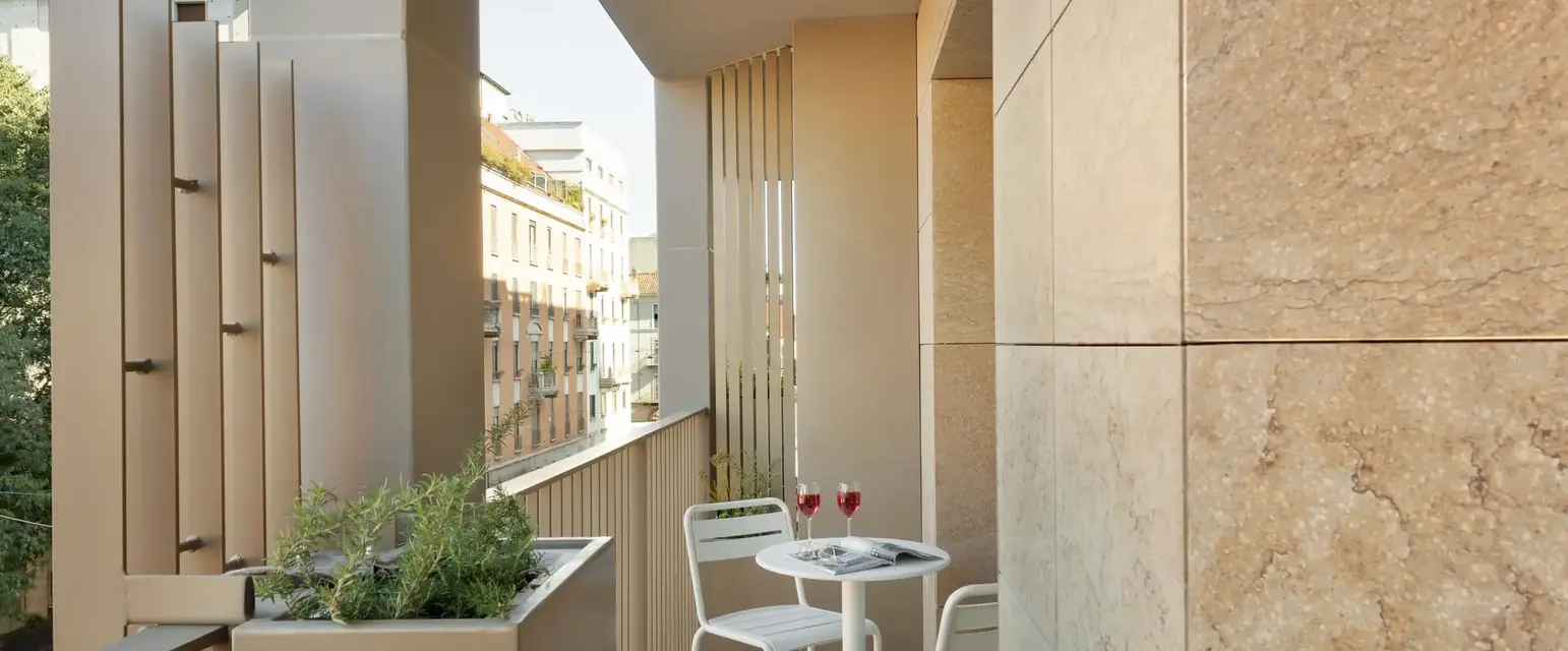 a table and chairs on a balcony