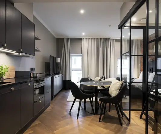 a room with a table and chairs